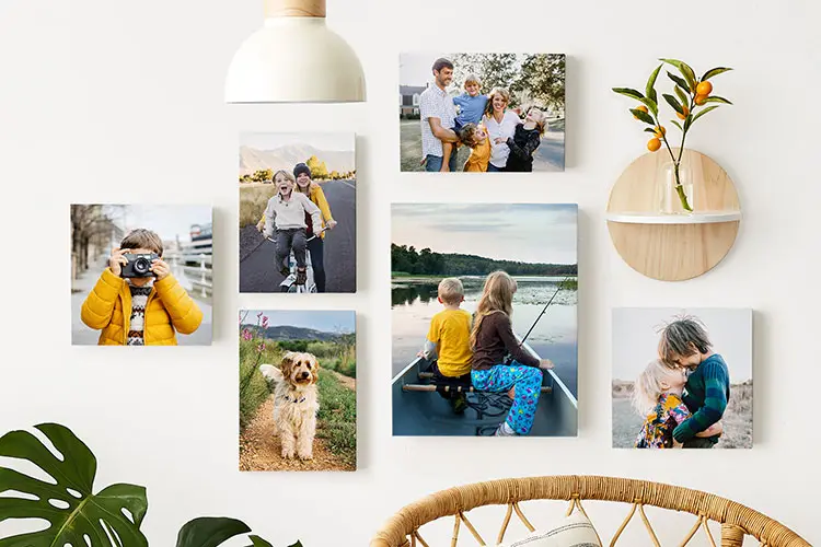 Canvas photo print gallery wall in home living room with images of family and kids.